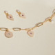 Greta irregular shape rose earrings in gold plating cover