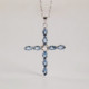 Las Estaciones cross aquamarine necklace in silver. cover