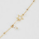 Pulsera ajustable estrella color perla bañada en oro cover