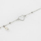 Pulsera ajustable corazón color perla elaborada en plata cover