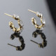 Arisa crystal curved earrings in gold plating cover