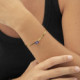 Serenity gold-plated rigid bracelet with purple crystal in rectangle shape cover