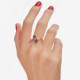 Cinnamon gold-plated doble ring with blue crystal in oval shape cover