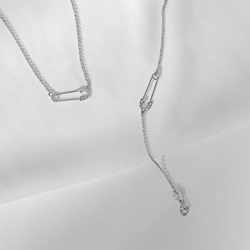 Apostrophe safety pin crystal necklace in silver