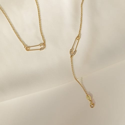 Apostrophe safety pin crystal necklace in gold plating