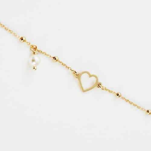 Pulsera ajustable corazón color perla bañada en oro