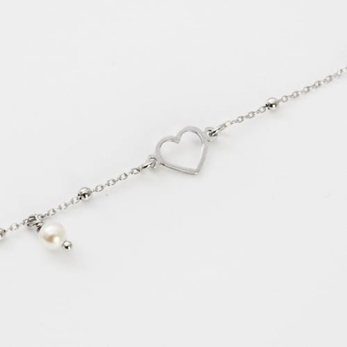 Pulsera ajustable corazón color perla elaborada en plata