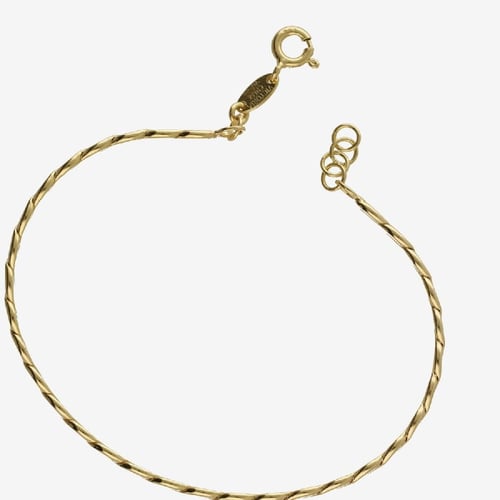 Fluency gold-plated rigid bracelet in braided shape