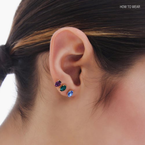 Cinnamon gold-plated stud earrings with blue crystal in oval shape