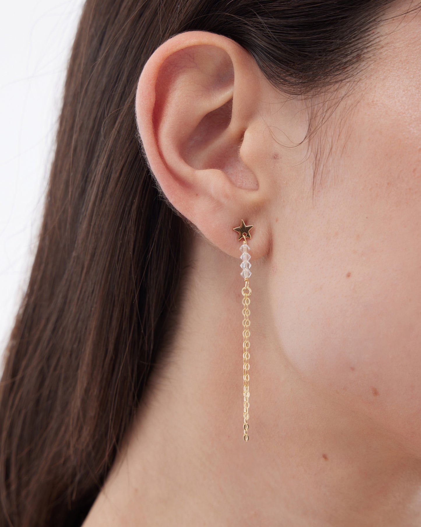 Pendientes largos Muse estrella y cadenas con cristal blanco en Plata