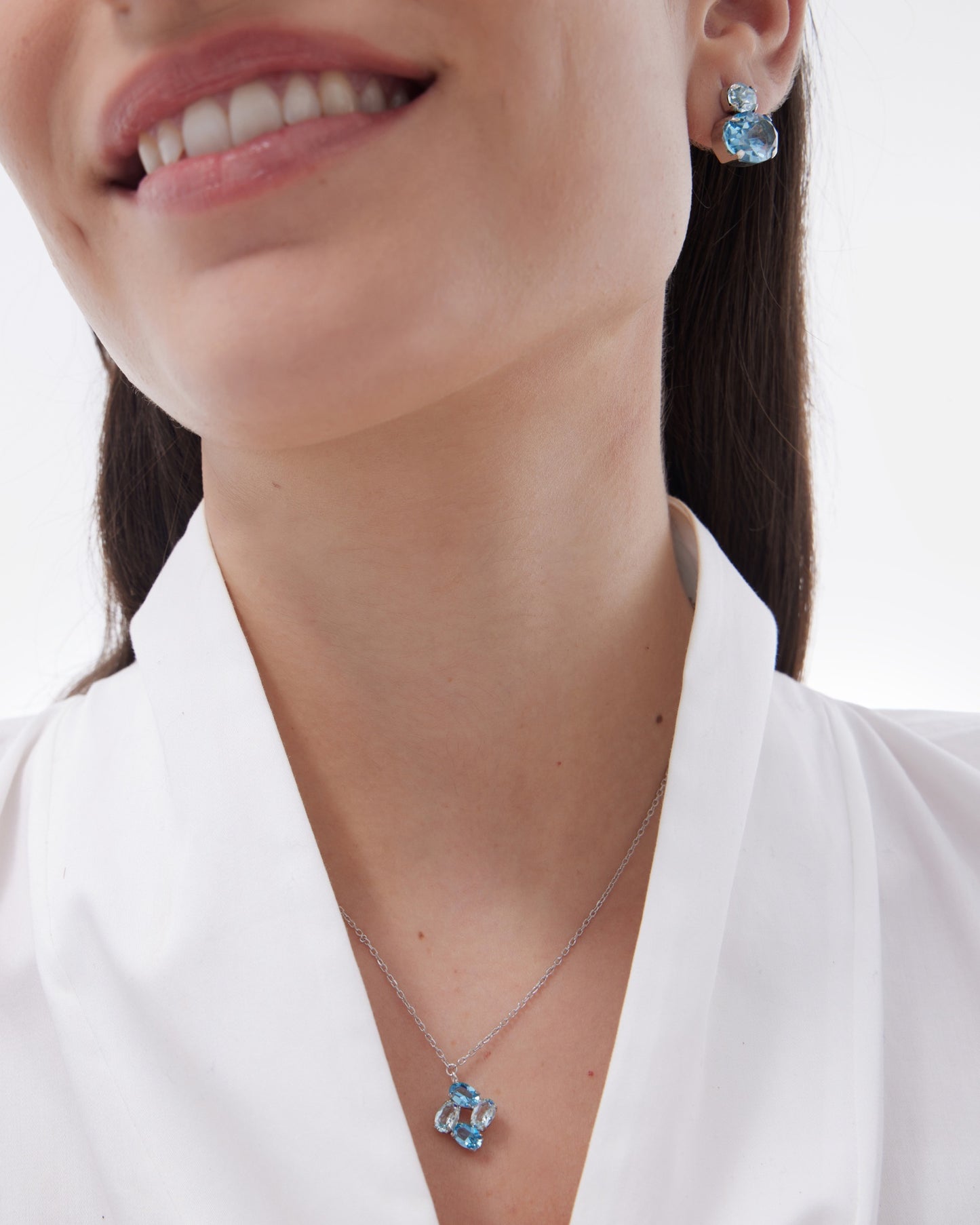 Pendientes botón Eau con cristal azul en Plata baño Rodio